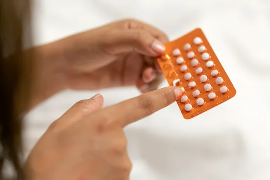 photo of birth control minipills in hand